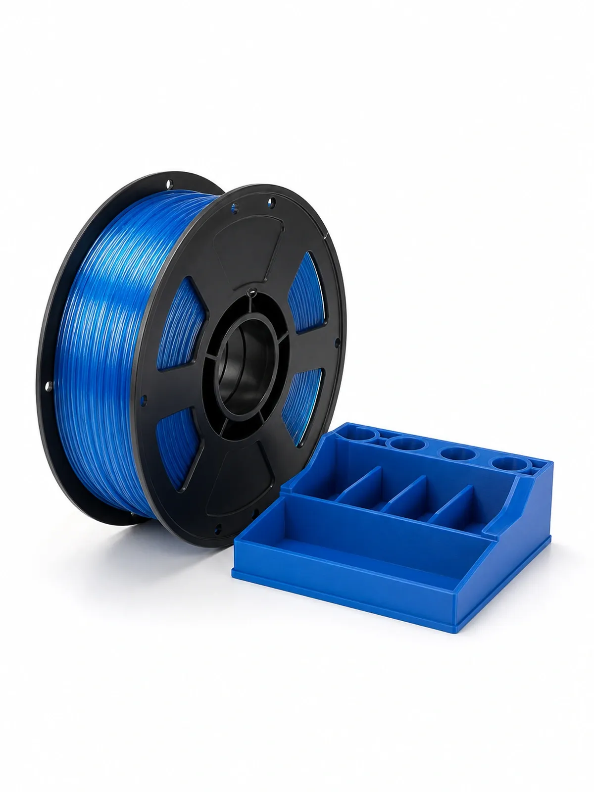 Unbranded PETG Basic filament spool beside a complete 3D-printed functional storage tray