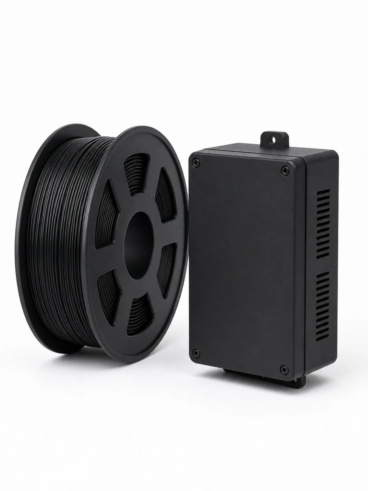 Unbranded ABS filament spool beside a complete 3D-printed durable electronics enclosure
