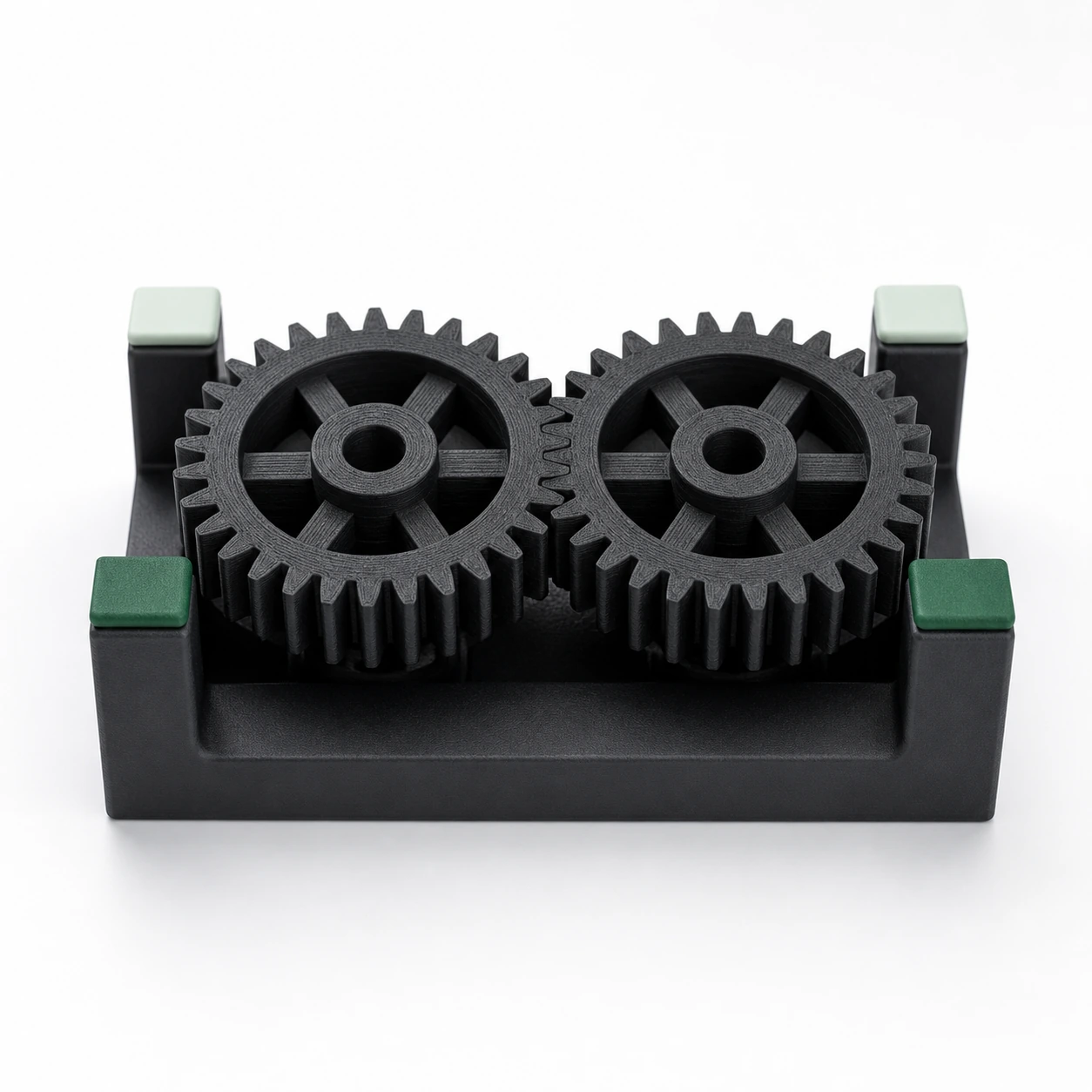 Black PAHT-CF: matched pair of intermeshing spur gears resting flat in a small fixture
