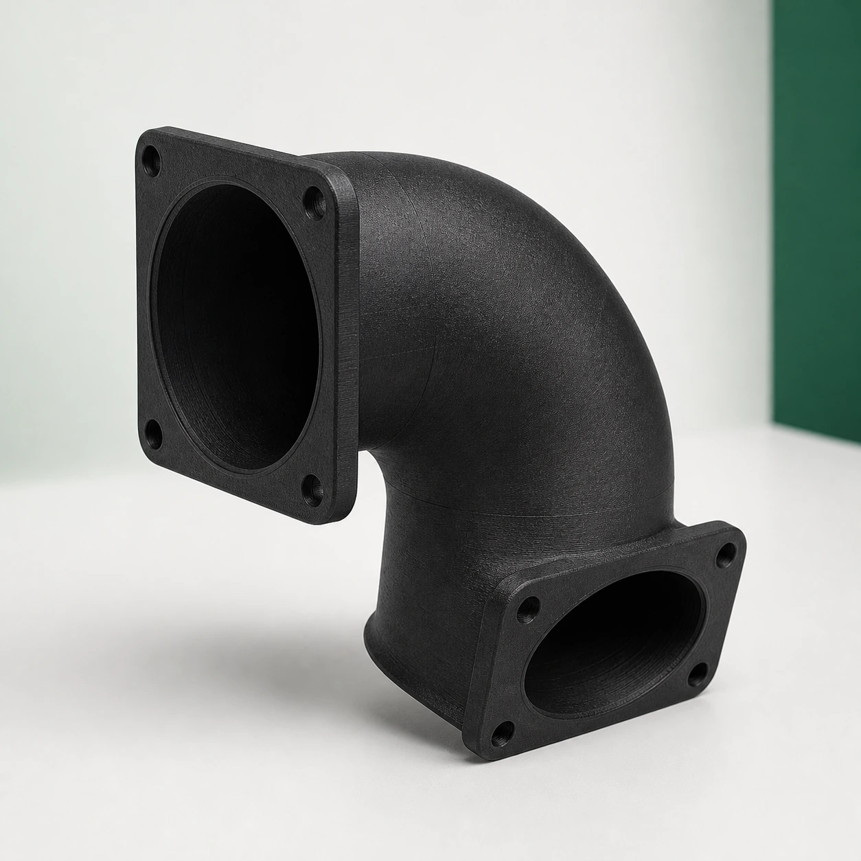 Black PAHT-CF: ninety-degree ventilation duct elbow with both open flanges fully visible