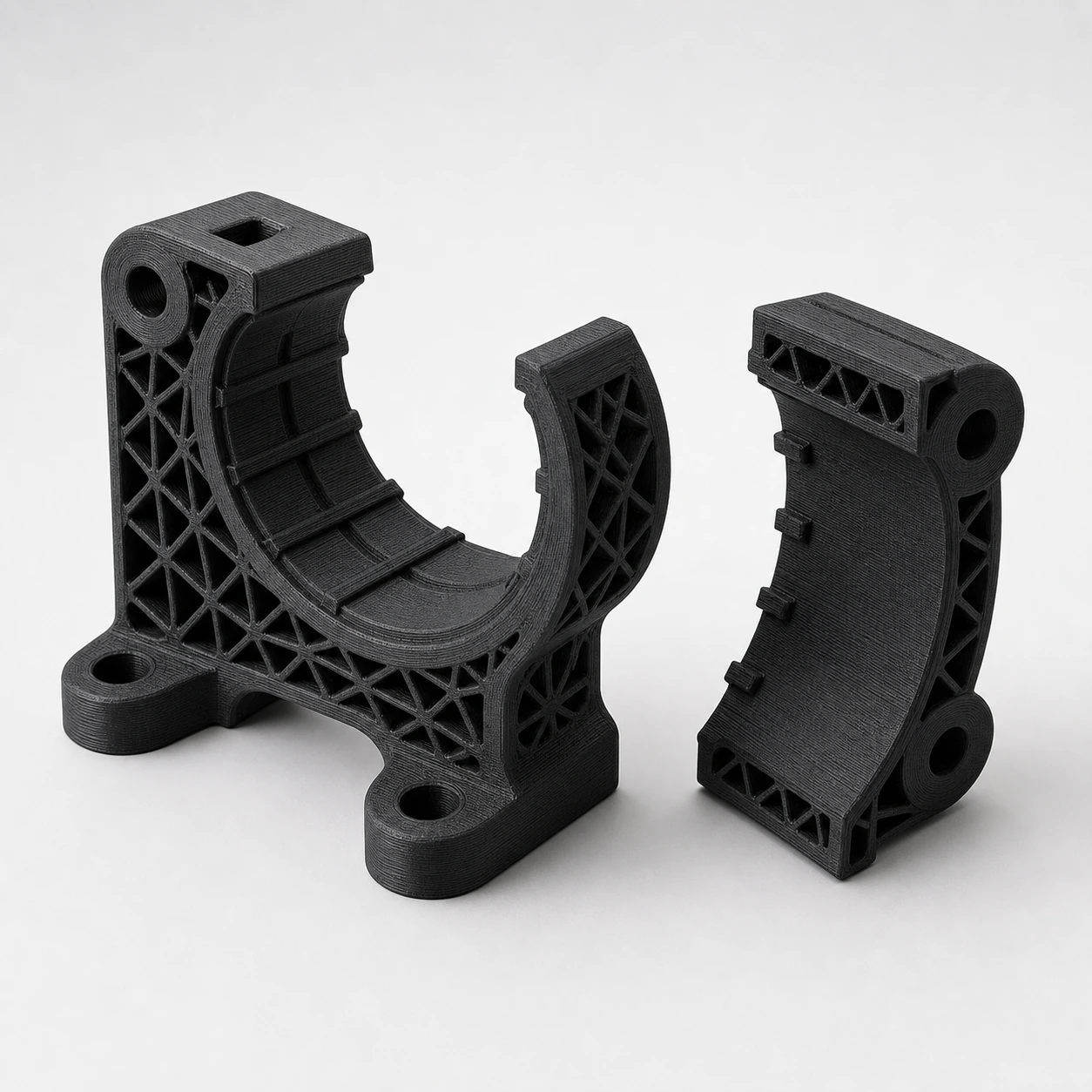 Black PAHT-CF: lattice-reinforced inspection clamp body with its separate matching jaw beside it