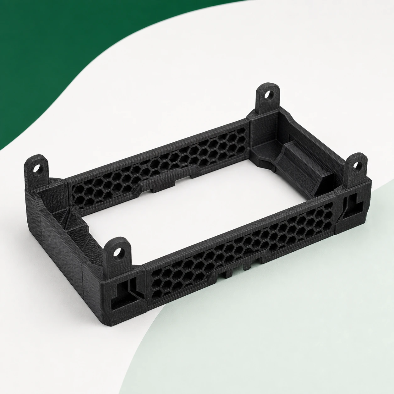 Black PAHT-CF: battery-module cradle with honeycomb ribs and four intact corner tabs
