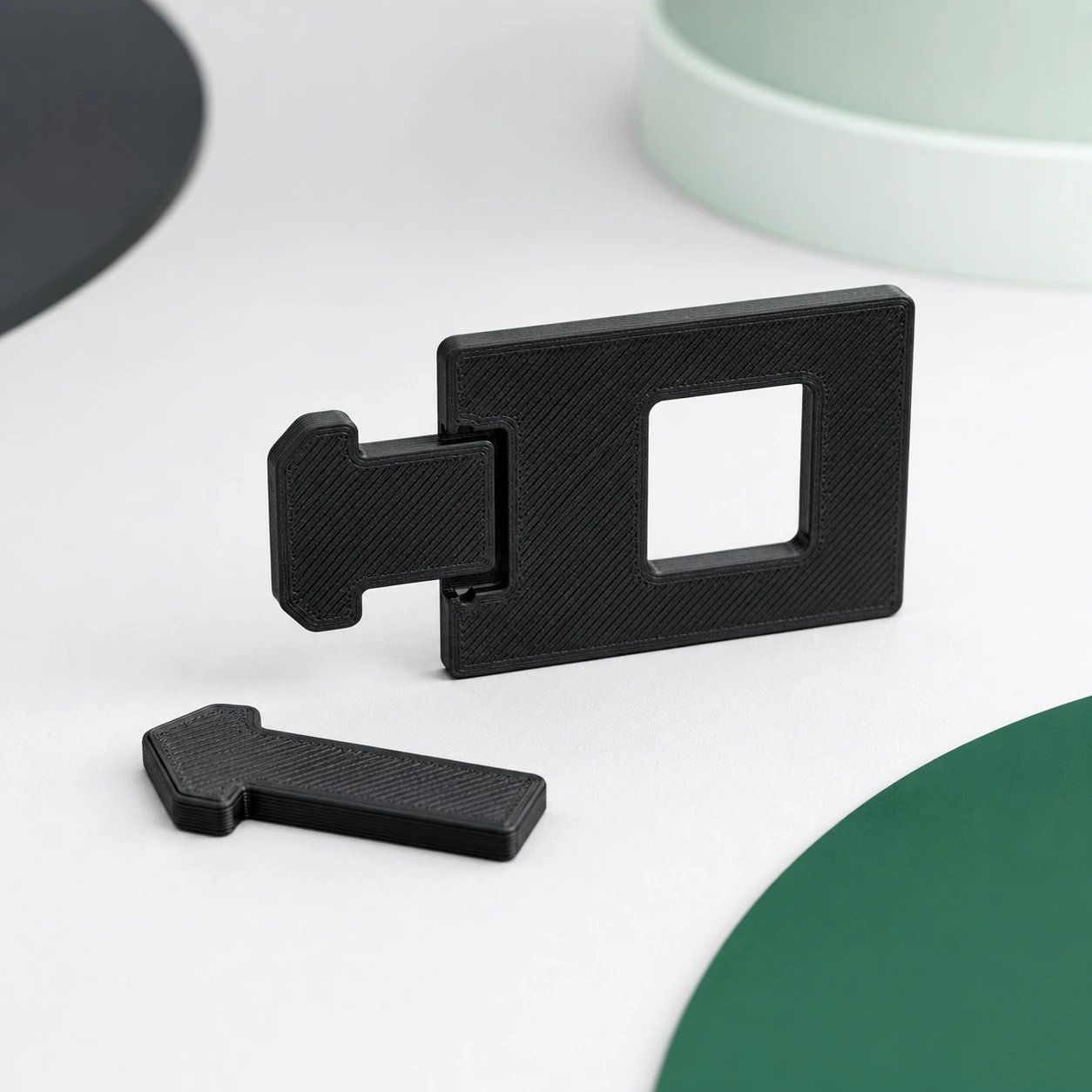 Black PAHT-CF: snap-fit tab-and-window coupon shown assembled with one matching loose reference tab