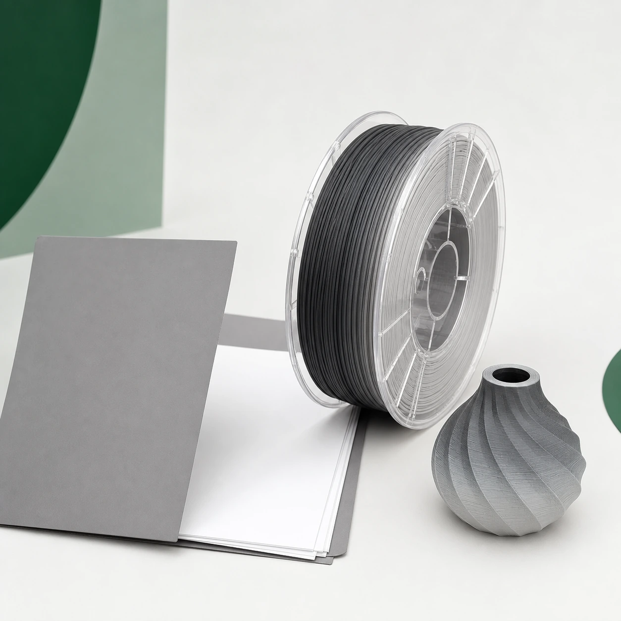 Gradient Silk Air PLA Basic Gradient: an unbranded grey folder with blank sheets beside gradient PLA spool and one intact printed sample