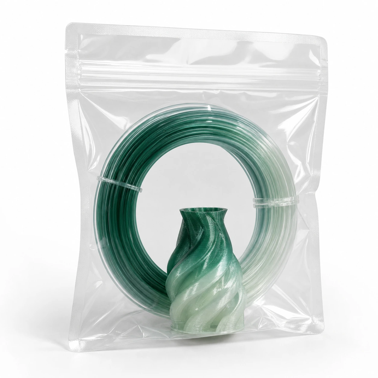 Gradient Silk Water PLA Basic Gradient: a transparent unbranded sealed pouch containing a short gradient filament coil and small 3D-printed sample
