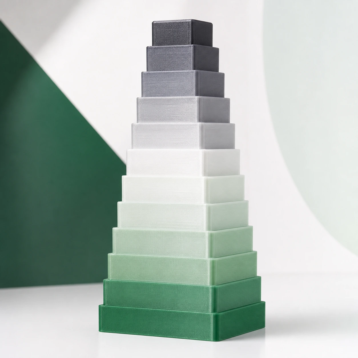Gradient Silk Water PLA Basic Gradient: tall stepped 3D-printed calibration tower with broad bands that reveal gradual filament color change