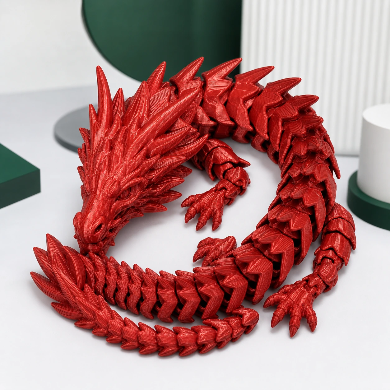 Red PLA Silk+ complete articulated eastern dragon curled into a compact circular pose, every limb and the entire tail visibly connected to the body
