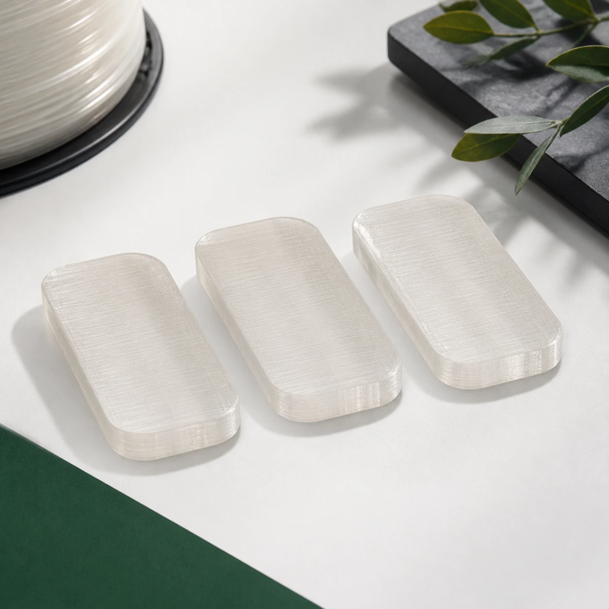natural translucent PLA Translucent three complete identical rounded rectangular material coupons
